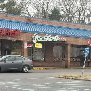 a car parked in front of a restaurant