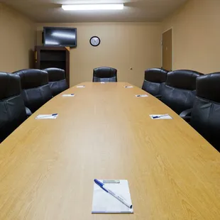 Our 2nd floor meeting room seats up to 9 people around a long conference table.