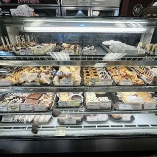 Display case of cake pops, buckeyes, brownies, cannolis, etc.