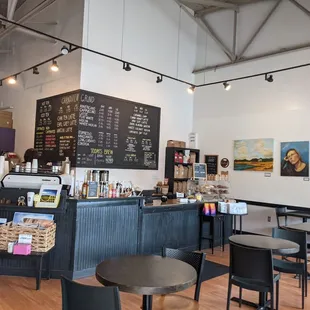 a coffee shop with tables and chairs