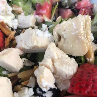 Dry, unseasoned, room temperature chicken chunks on a summer salad. $15 or so.