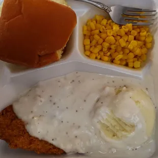 Chicken fried steak, mashed potatoes, corn, rolls
