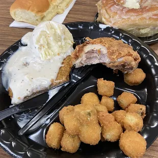 a plate of fried chicken and bread