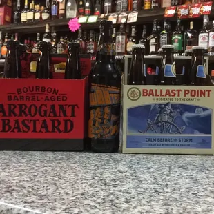 a variety of bottles on a bar counter