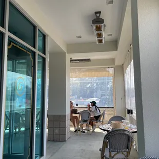 Outdoor seating area (with plastic paneling to keep out drafts and heat lamps)
