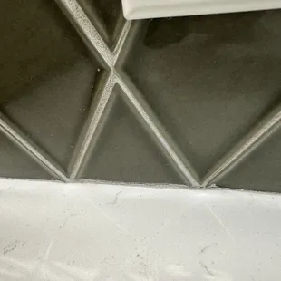 Grout cracking and coming out from Improper installation, no sealant.