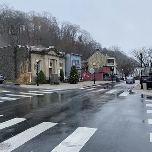 a wet street in a small town