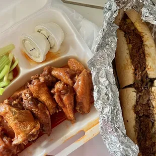 Takeout- wings and Italian cheesesteak with both mild and spicy peppers