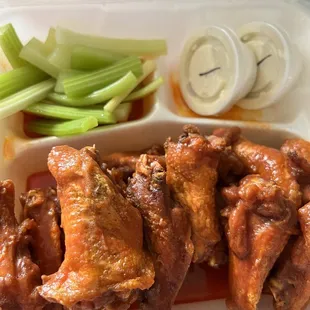 Buffalo wings, celery, and blue cheese