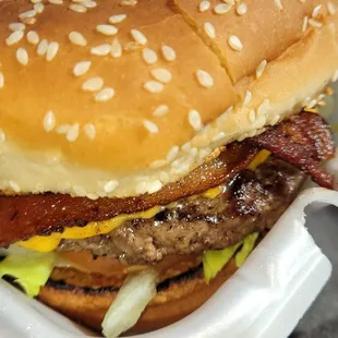 a burger in a styrofoam container
