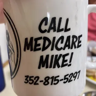 a person holding a coffee mug