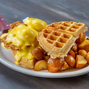a plate of waffles and potatoes