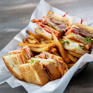a basket of sandwiches and french fries