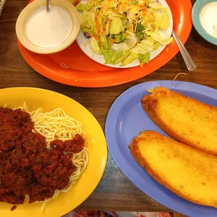 Spaghetti with meat sauce a dinner salad and garlic bread