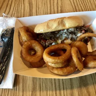 Philly cheesesteak &amp; onion rings. Yum!