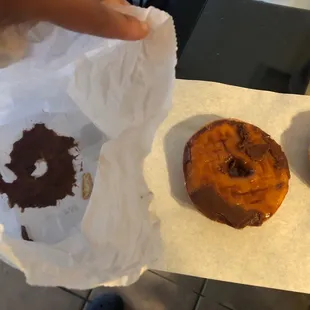 All the glaze stayed on the bag because the employee placed the donut faced down and packed the bag to the rim