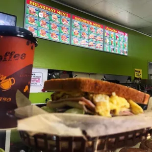 a sandwich and a cup of coffee