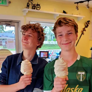 two boys eating ice cream cones