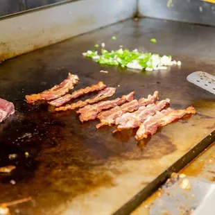 a steak being cooked on a grill