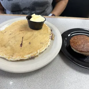 One blueberry pancake with side of sausage