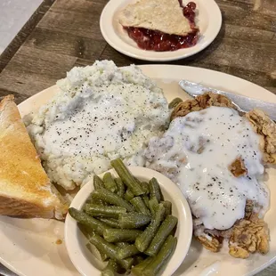 Chicken fried steak, mashed potatoes, green beans, toast &amp; cherry pie for dessert