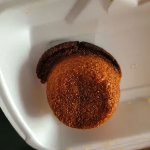 a donut in a styrofoam container
