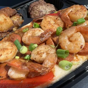 a tray of shrimp and scallops