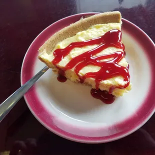 Cheesecake with raspberry drizzle