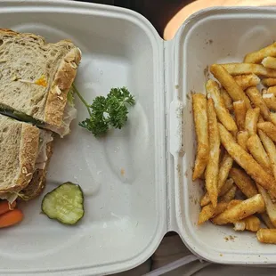 Turkey and avocado sandwich on wheat with French fries
