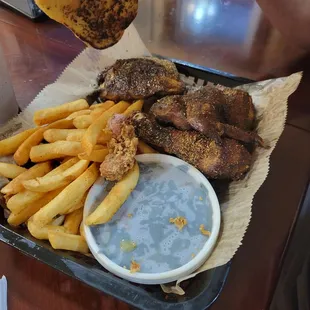 Chicken and French fries with greens