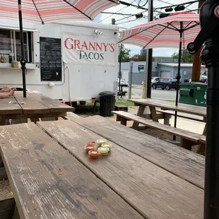 a picnic table with an umbrella