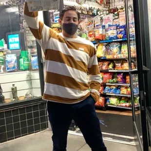 a man standing in front of a store