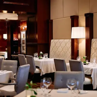 a dining room with tables and chairs