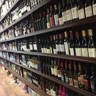 rows of wine bottles on shelves