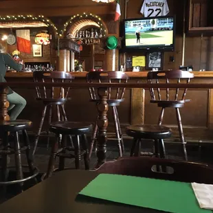 a man sitting on a bar stool