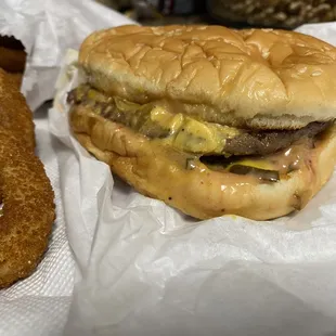 a hamburger and onion rings