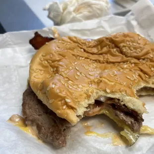 a hamburger with a bite taken out of it