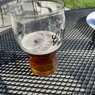 a glass of beer on a table