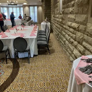 a banquet room with tables and chairs