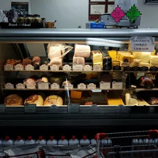 a display of cheeses and other foods