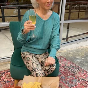 a woman holding a glass of wine