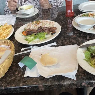 Shish tawook. Shish kabob. Shish kafta. Rice. House salad. Bread. Garlic. Tahini. Delish!