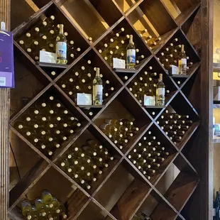 a wine rack full of wine bottles