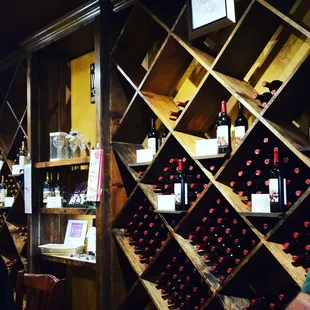 a wine rack with wine bottles