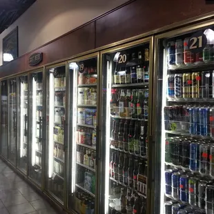 a row of refrigerators filled with beverages
