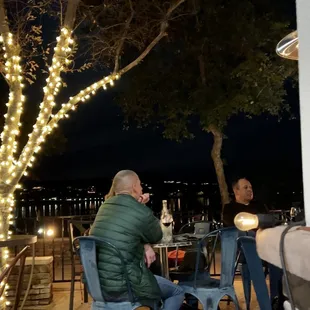 Patio on the lake, fountain, park ~ with full moon rising above Four Peaks to the east.