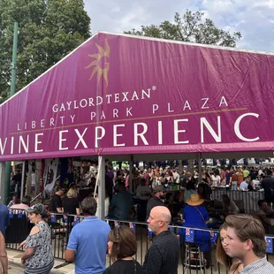 a crowd of people at a wine experience