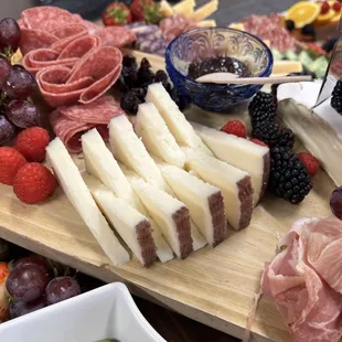 Goat cheese, assorted fruit, meats, spreads, and bread