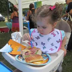 The birthday girl enjoying her Italian Sub feast!