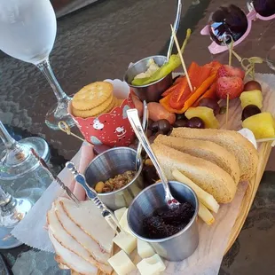 a glass of wine and a platter of food